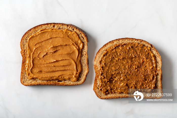 Open sandwiches from various kind of wholegrain bread with different nut butter, such as peanut, crunchy cashew and almond butter