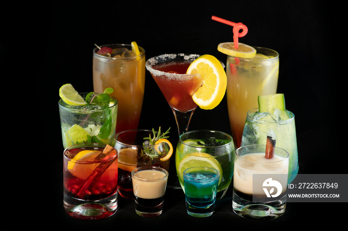 Mix alcoholic cocktails together with isolated black background