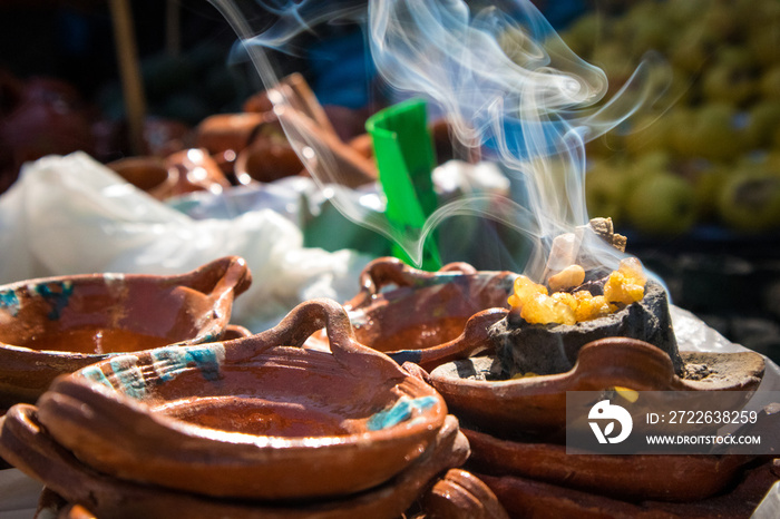 Copal (Incense) Burning with Smoke in Clay Pots at Market in Mexico City