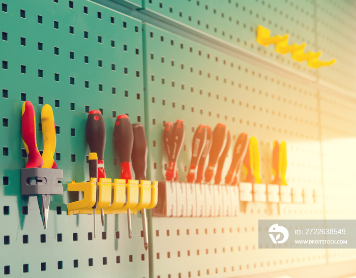 engineer tool storage on wall  with green background