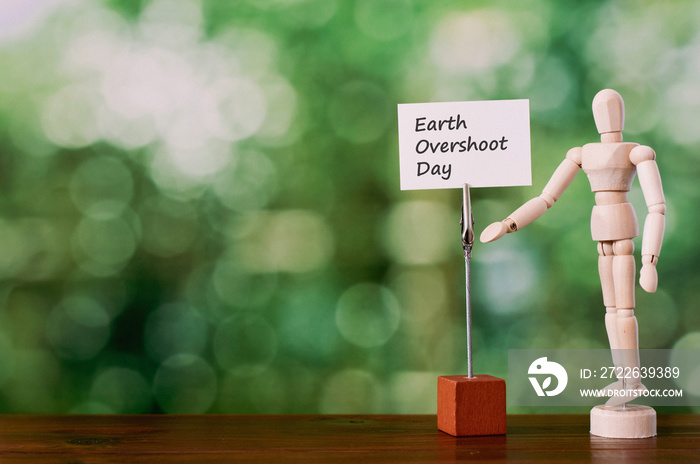 There is piece of paper with the word Earth Overshoot Day.