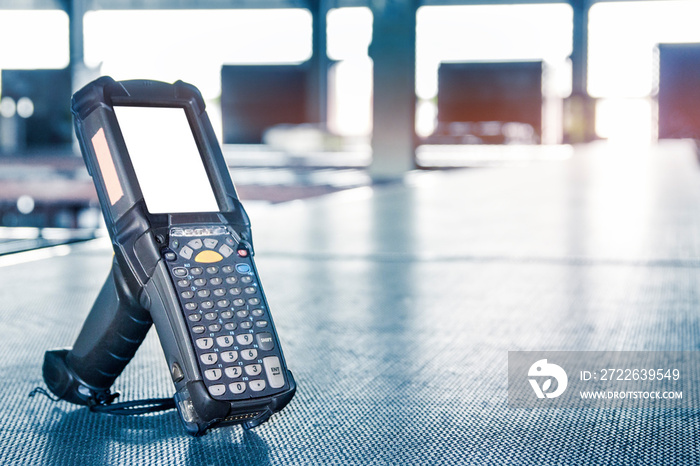 barcode scanner on conveyor belt in distribution warehouse.