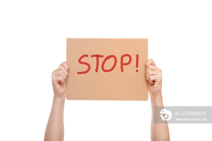 demonstrator hands are holding protest poster with the message Stop, cardboard with text mockup isolated on white background.