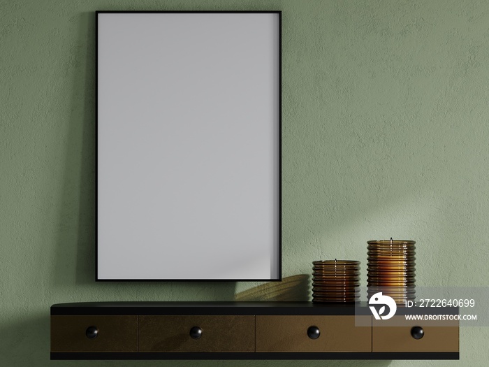 Closeup on a table with yellow glass candles and a large vertical painting in a black frame canvas a blank. Gold shelf with drawers with black elements. Mint light green wall in plaster. 3d rendering