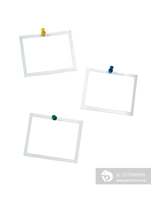 Instant frames hang on wall with colored pins. Isolated