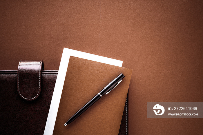 Vintage business briefcase on the office table desk, flatlay background