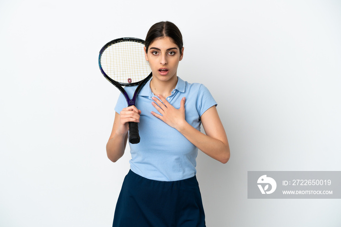 Handsome young tennis player caucasian woman isolated on white background surprised and shocked while looking right