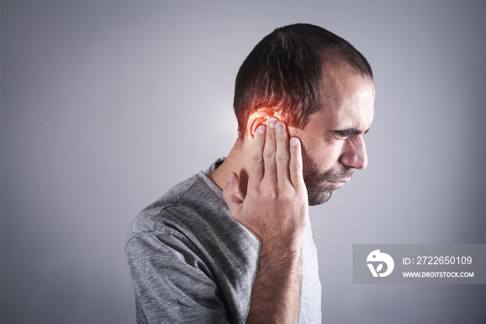 Caucasian man with ear pain.