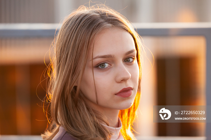 Pretty blond teenage girl, close-up