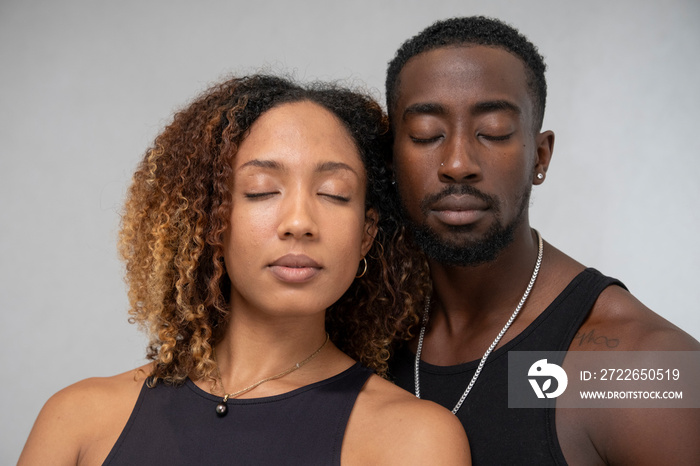 Portrait of couple with closed eyes