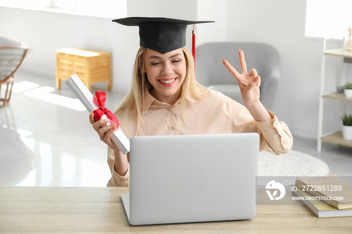 Happy female student on her graduation day at home. Concept of online education