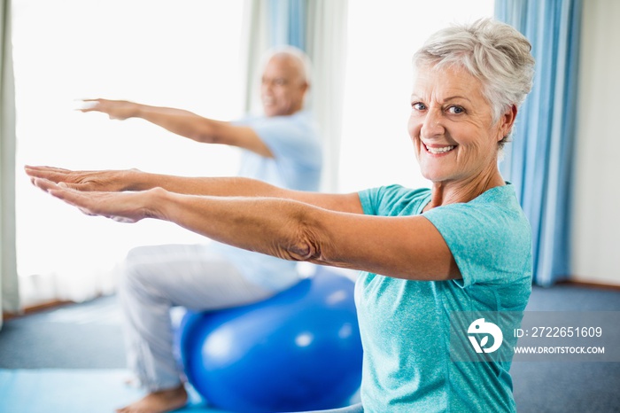 Seniors using exercise ball