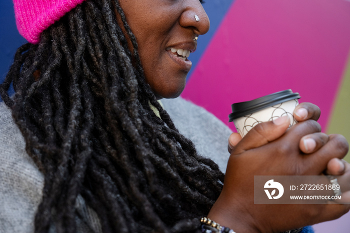 Close up of beautiful woman holding coffee cup