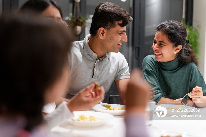 Family dining at home in evening