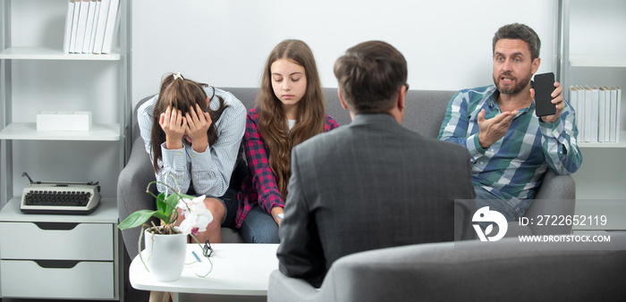 Psychological parents problem. Social worker psychologist talking to father with smartphone, sad mother and daughter teenage girl. Psychological parents problem, family therapy. Social media problem.