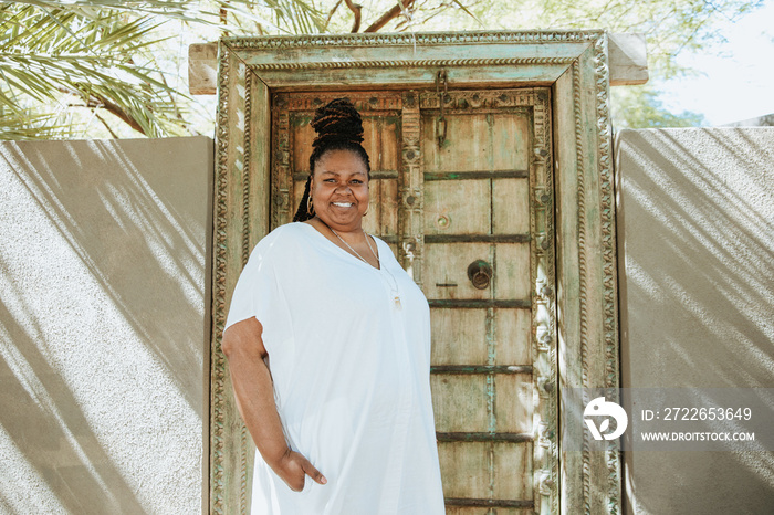 plus size African American woman standing outside a door