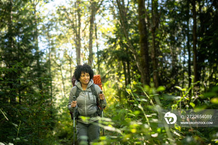 U.S. Army female soldier putting in the miles with an early morning hike in the NorthWest.