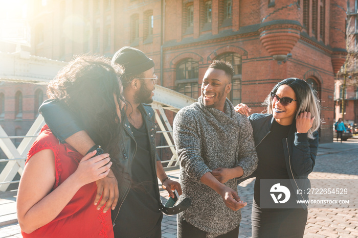 Multiracial group of friends having fun and laughing together