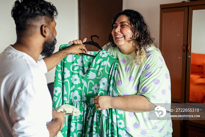 Couple choosing what to wear to start the day