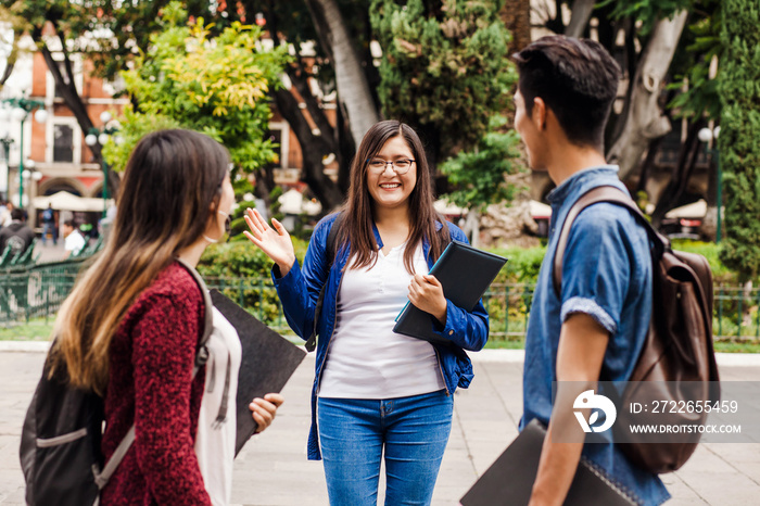 young mexican woman in group of Latin students in university in Latin America