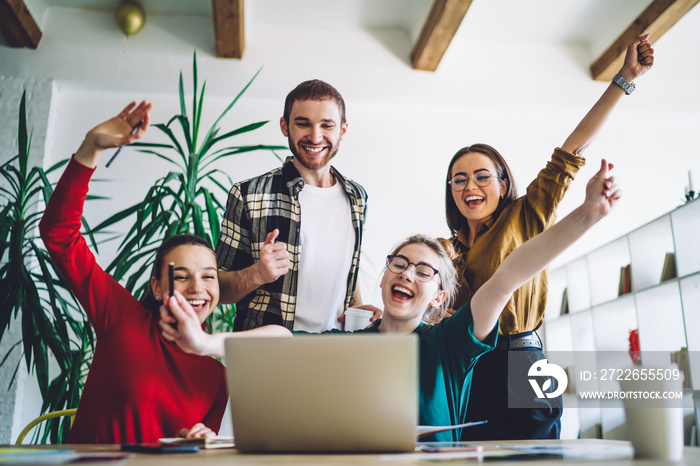 Cheerful friends celebrating homework fulfillment