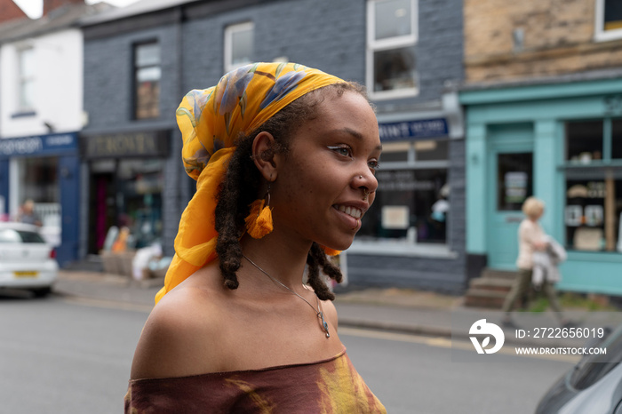 Portrait of smiling woman walking in city