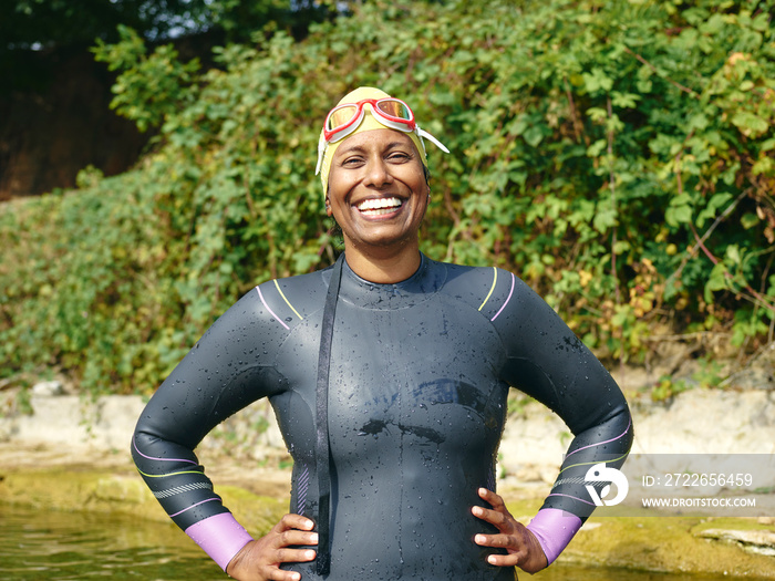 Portrait of smiling woman in wetsuit