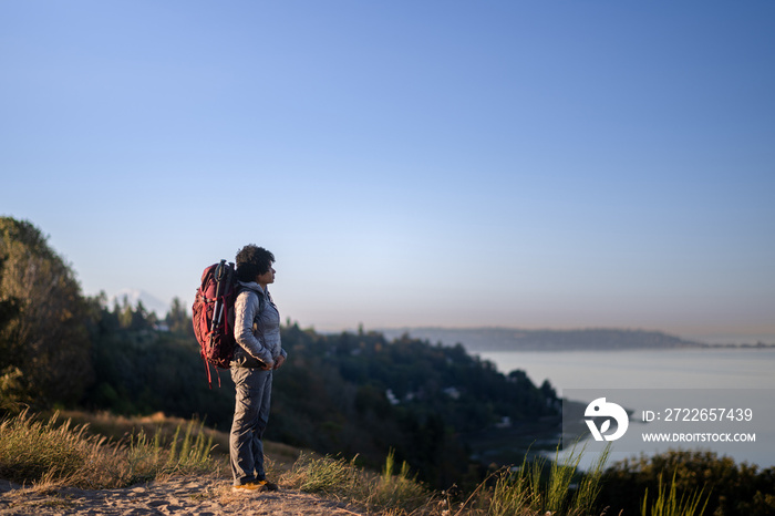 U.S. Army female soldier putting in the miles with an early morning hike in the NorthWest.