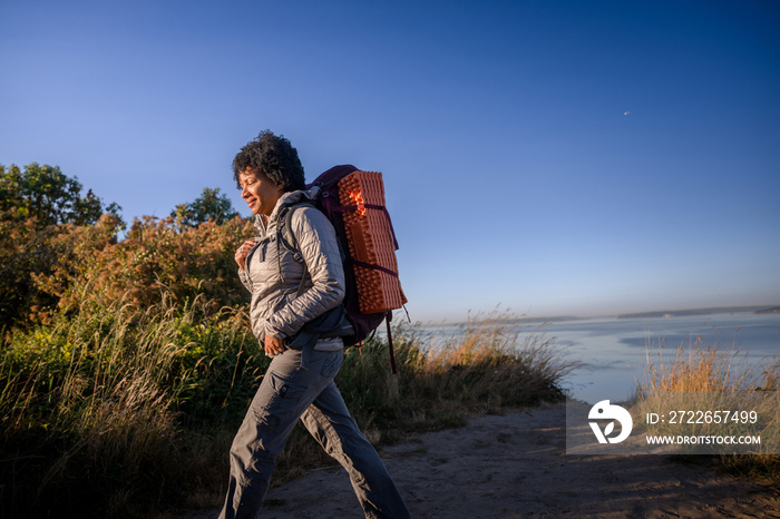 U.S. Army female soldier putting in the miles with an early morning hike in the NorthWest.