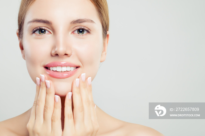 Beautiful face with pink glossy lips and manicured hands with french manicure nails, closeup portrait