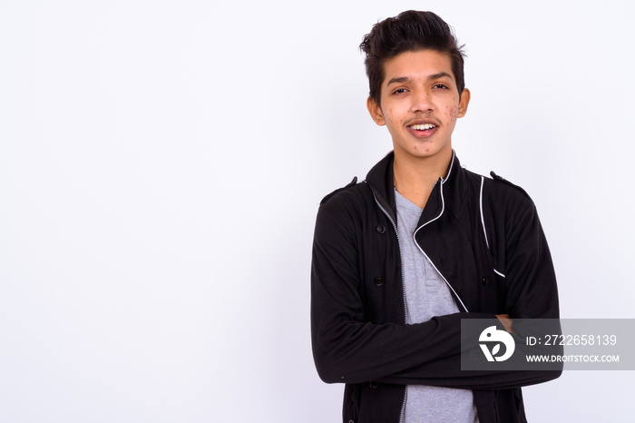 Portrait of young handsome Indian teenage boy