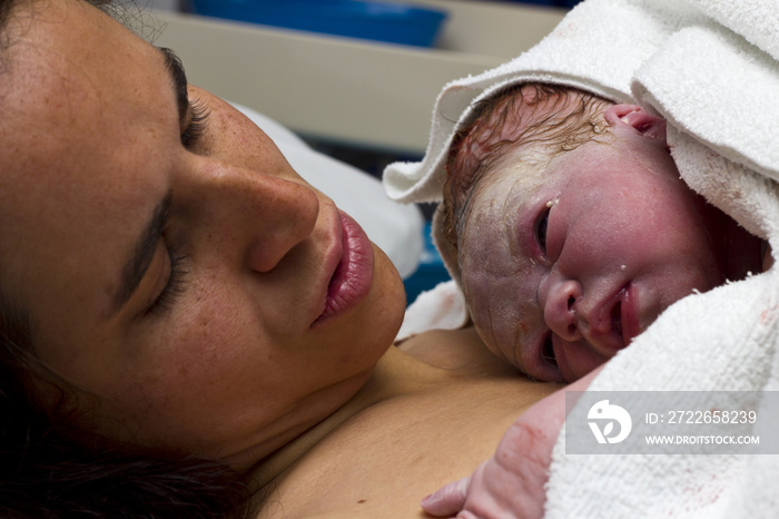 Mother with newborn baby in hospital