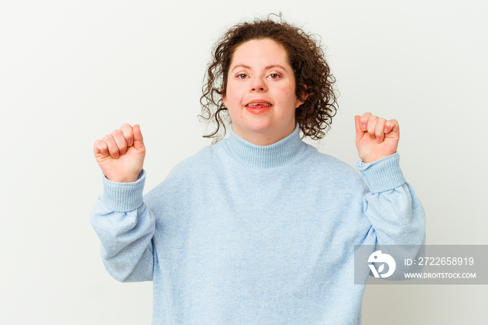 Woman with Down syndrome isolated dancing and having fun.