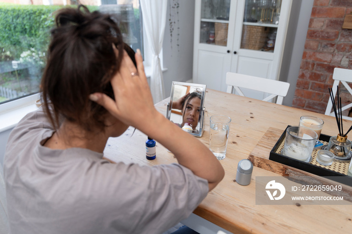 Woman preparing hair at home