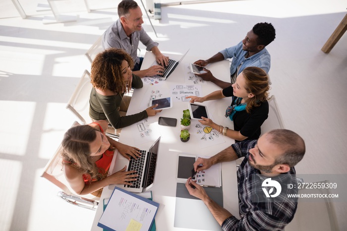 Executives interacting with each other during meeting