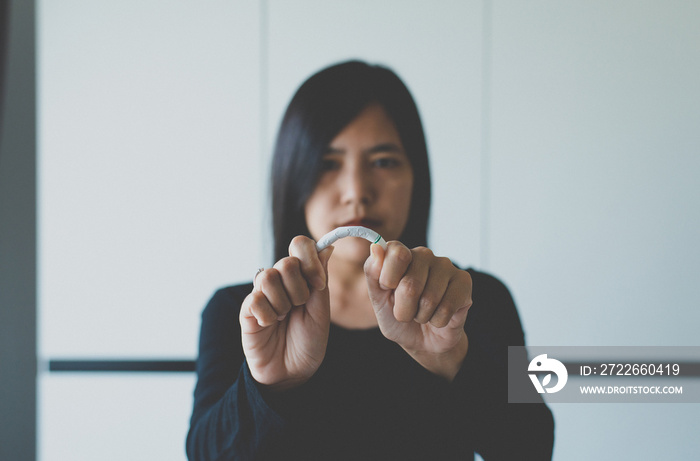 Woman hands destroying or crushing cigarette,Concept no smoking day world quitting world no tobacco in 31 may day