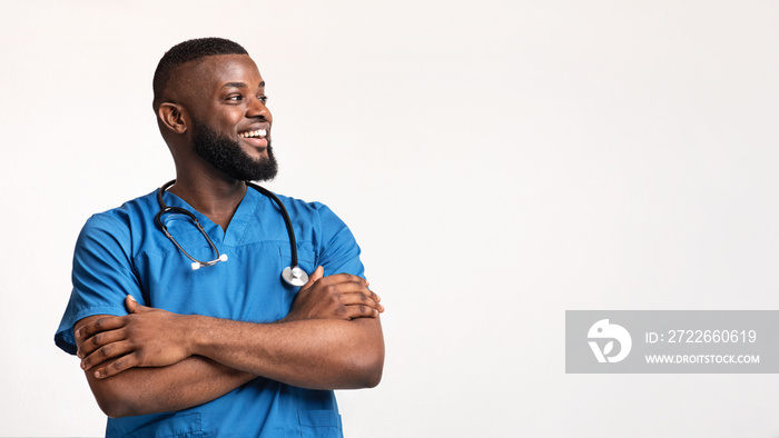 Excited black young doc looking at empty space