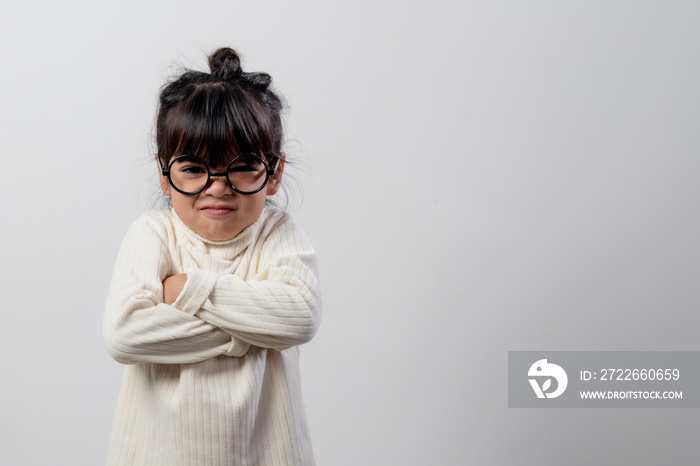 Angry little girl over white background, sign and gesture concept