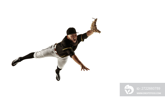 In flight. Baseball player, pitcher in black uniform practicing and training isolated on white background. Young professional sportsman in action and motion. Healthy lifestyle, sport, movement concept