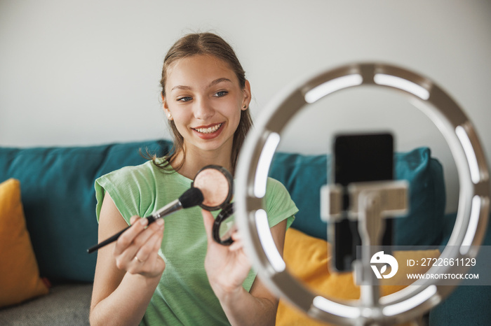 Teenager Girl Making A Video Blog On A Smartphone At Her Home