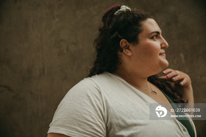 close up portrait of plus size jewish woman looking away