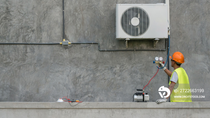 Technician is checking air conditioner