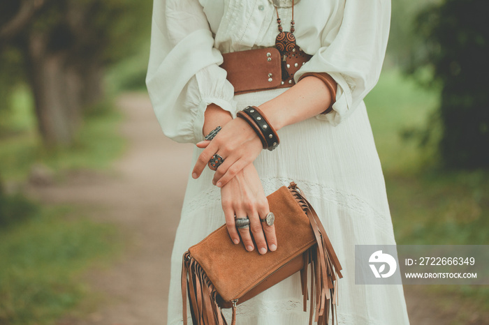 Brown handbag in the hands of a woman