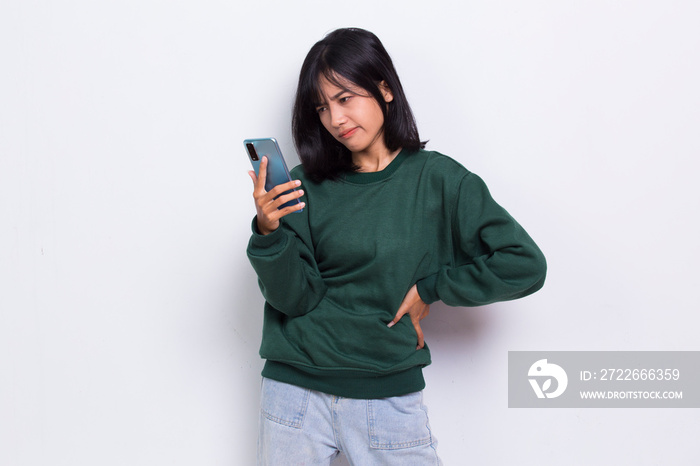 mad and shock young asian beautiful woman using mobile phone isolated on white background