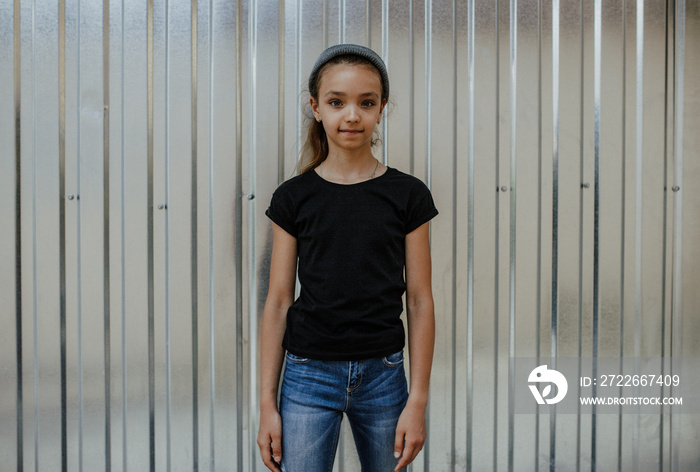 Girl kid wearing black blank t-shirt. Mock up for print.