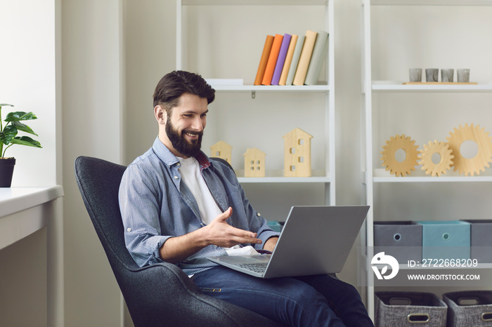 Happy bearded man making video call