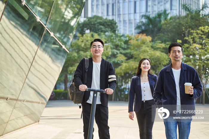 young asian adult men woman commuter walking on street in modern city