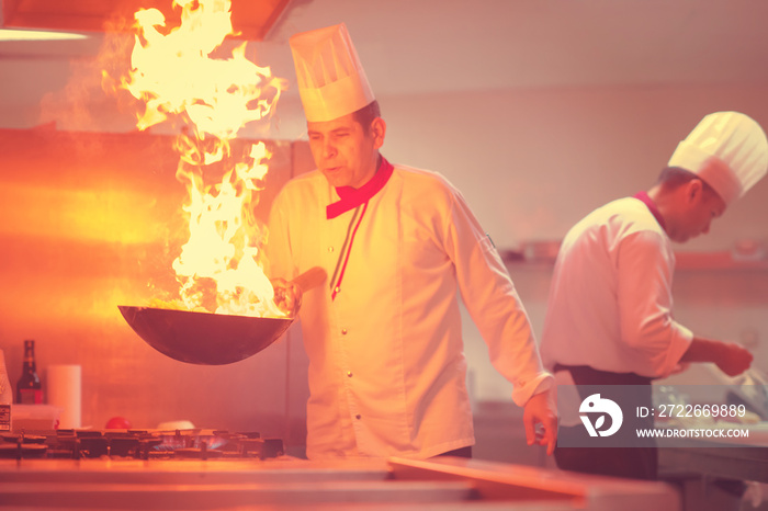 Chef doing flambe on food