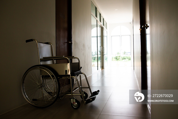 Empty wheelchair left at the hospital corridor.