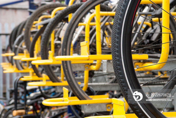 bikes lined up in the store in yellow rack